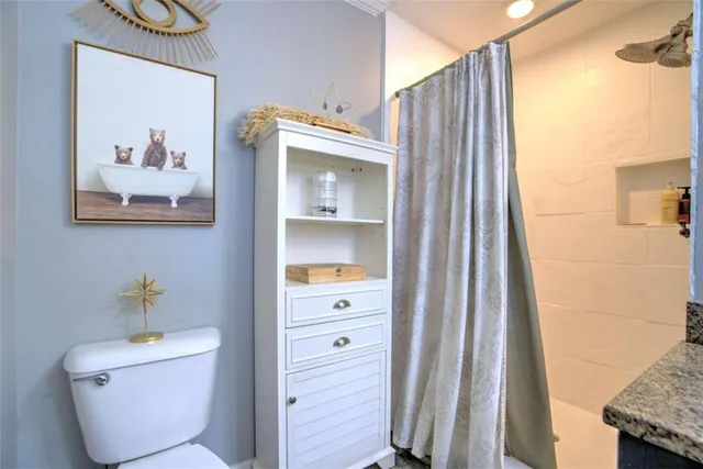 a bathroom with a toilet and a sink