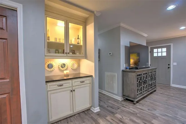 a kitchen with granite countertop a stove and a sink