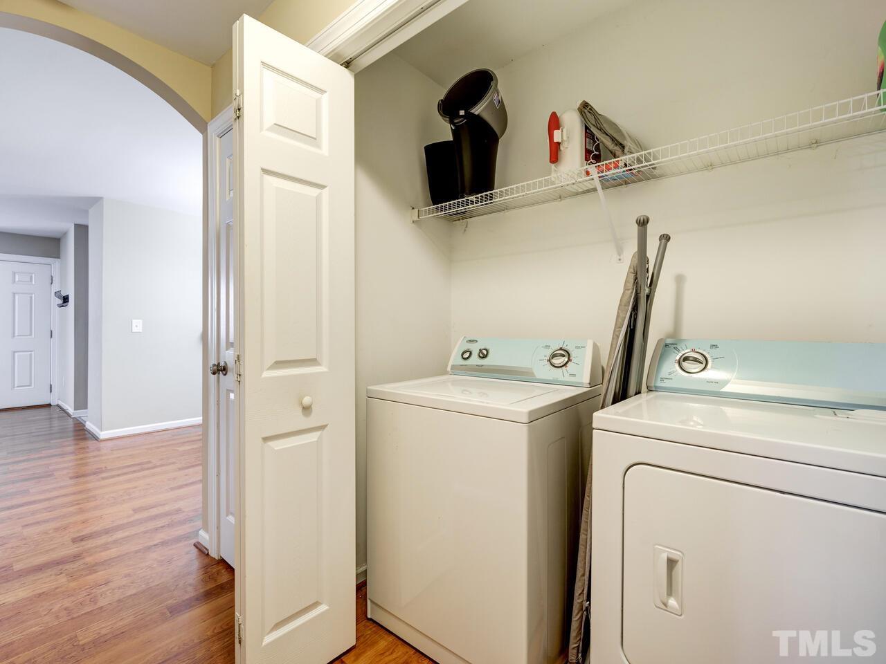 2221 Mountain Mist Court, Unit 101 Raleigh, NC 27603 - Photo 14 of 31 a view of storage and utility room with washer and dryer