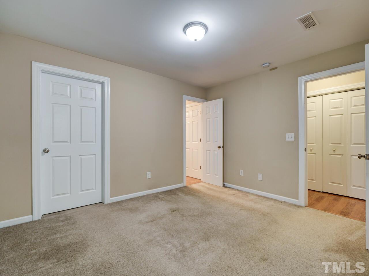 2221 Mountain Mist Court, Unit 101 Raleigh, NC 27603 - Photo 15 of 31 an empty room with an entryway