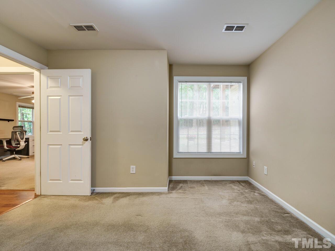 2221 Mountain Mist Court, Unit 101 Raleigh, NC 27603 - Photo 16 of 31 an empty room with windows and closet
