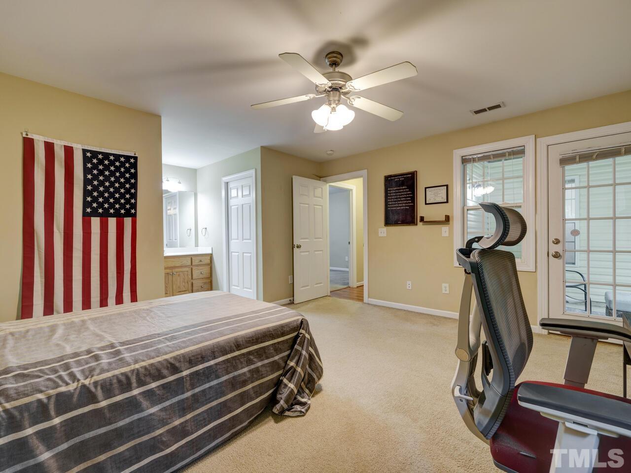 2221 Mountain Mist Court, Unit 101 Raleigh, NC 27603 - Photo 19 of 31 a bedroom with a bed and a window
