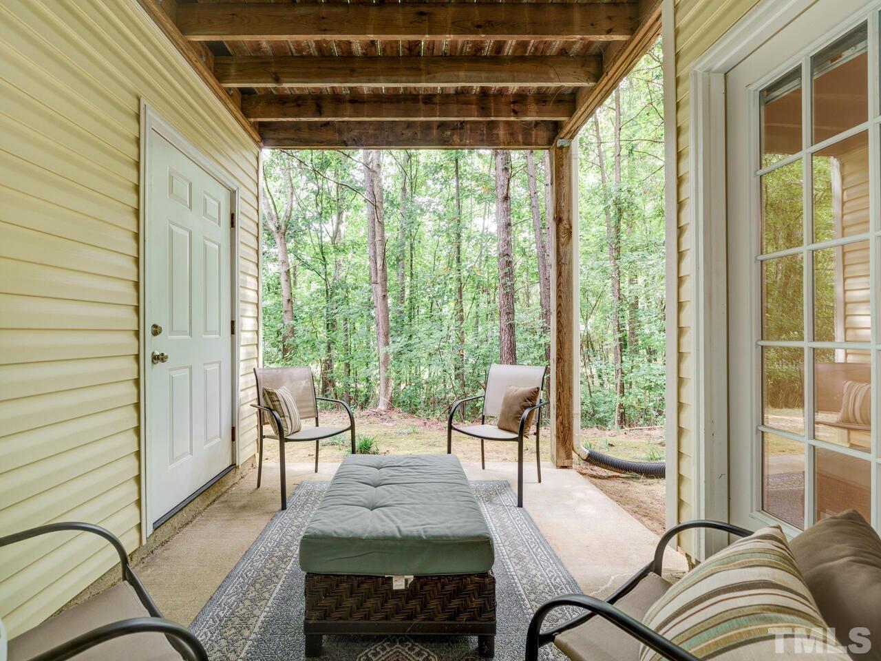 2221 Mountain Mist Court, Unit 101 Raleigh, NC 27603 - Photo 2 of 31 a living room with furniture and a floor to ceiling window