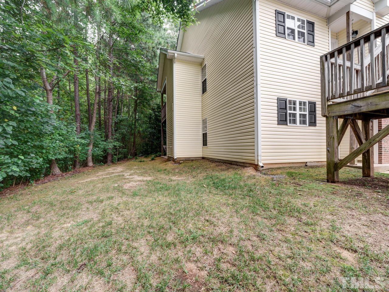 2221 Mountain Mist Court, Unit 101 Raleigh, NC 27603 - Photo 3 of 31 a view of a house with a yard