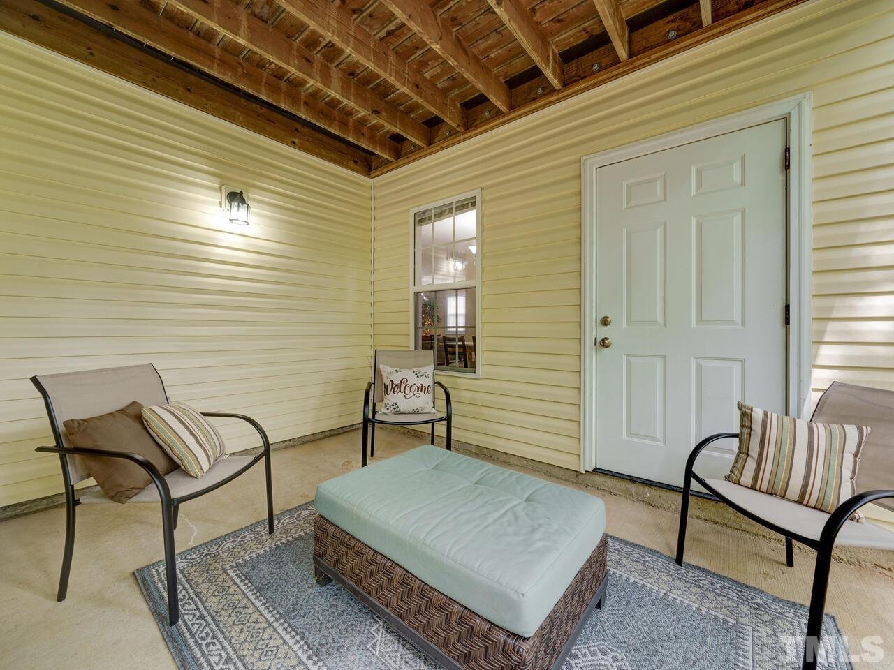 2221 Mountain Mist Court, Unit 101 Raleigh, NC 27603 - Photo 4 of 31 a living room with furniture and a window
