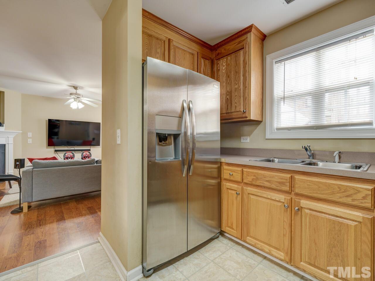 2221 Mountain Mist Court, Unit 101 Raleigh, NC 27603 - Photo 9 of 31 a kitchen with stainless steel appliances granite countertop a refrigerator and a sink