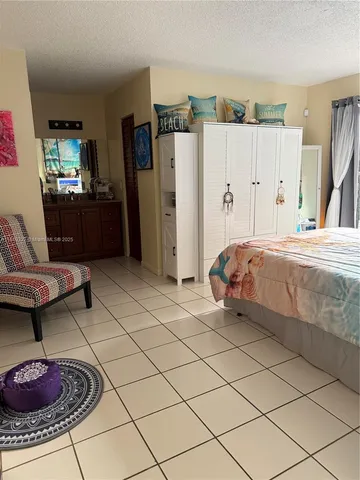 a bed room with a bed and a couch