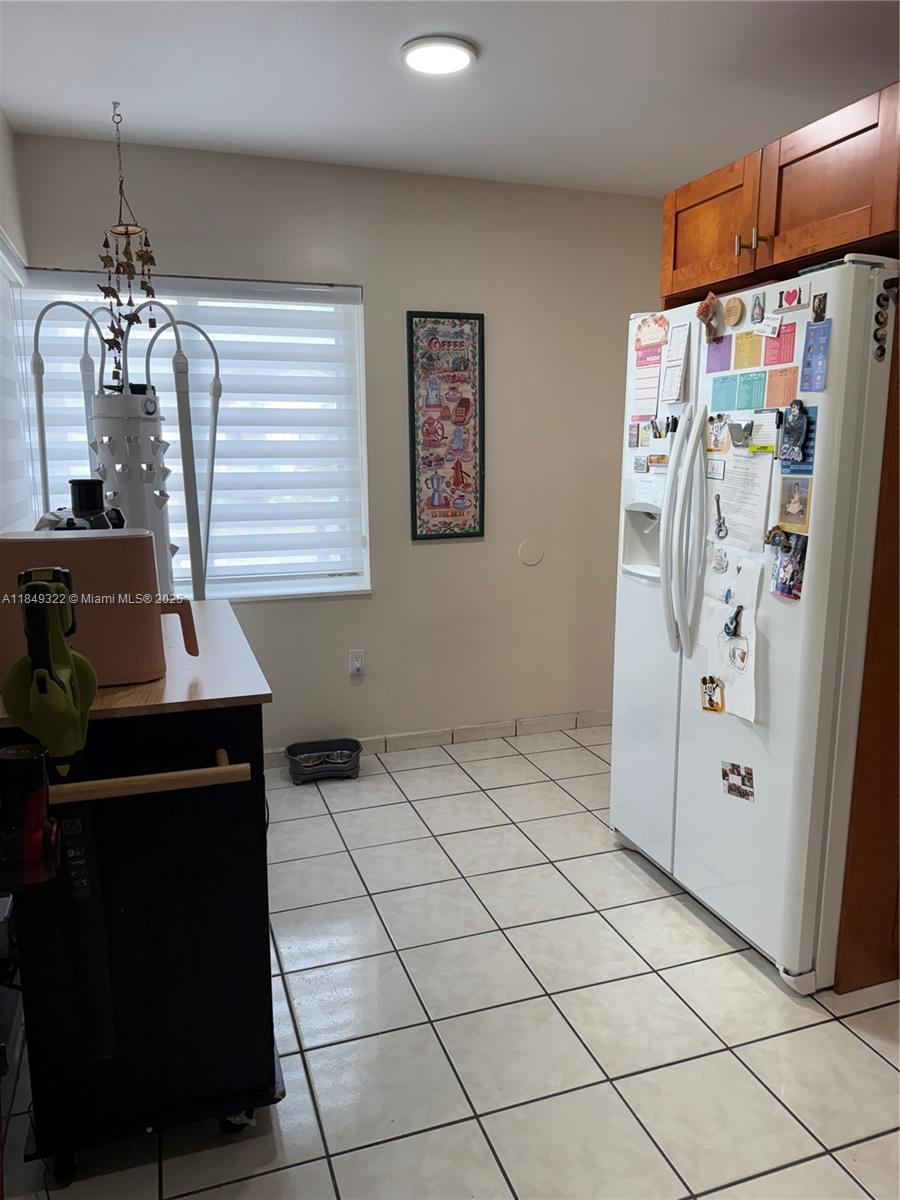 13402 Southwest 116th Place Miami, FL 33176 - Photo 14 of 16 a view of a storage & utility room with two washing machine