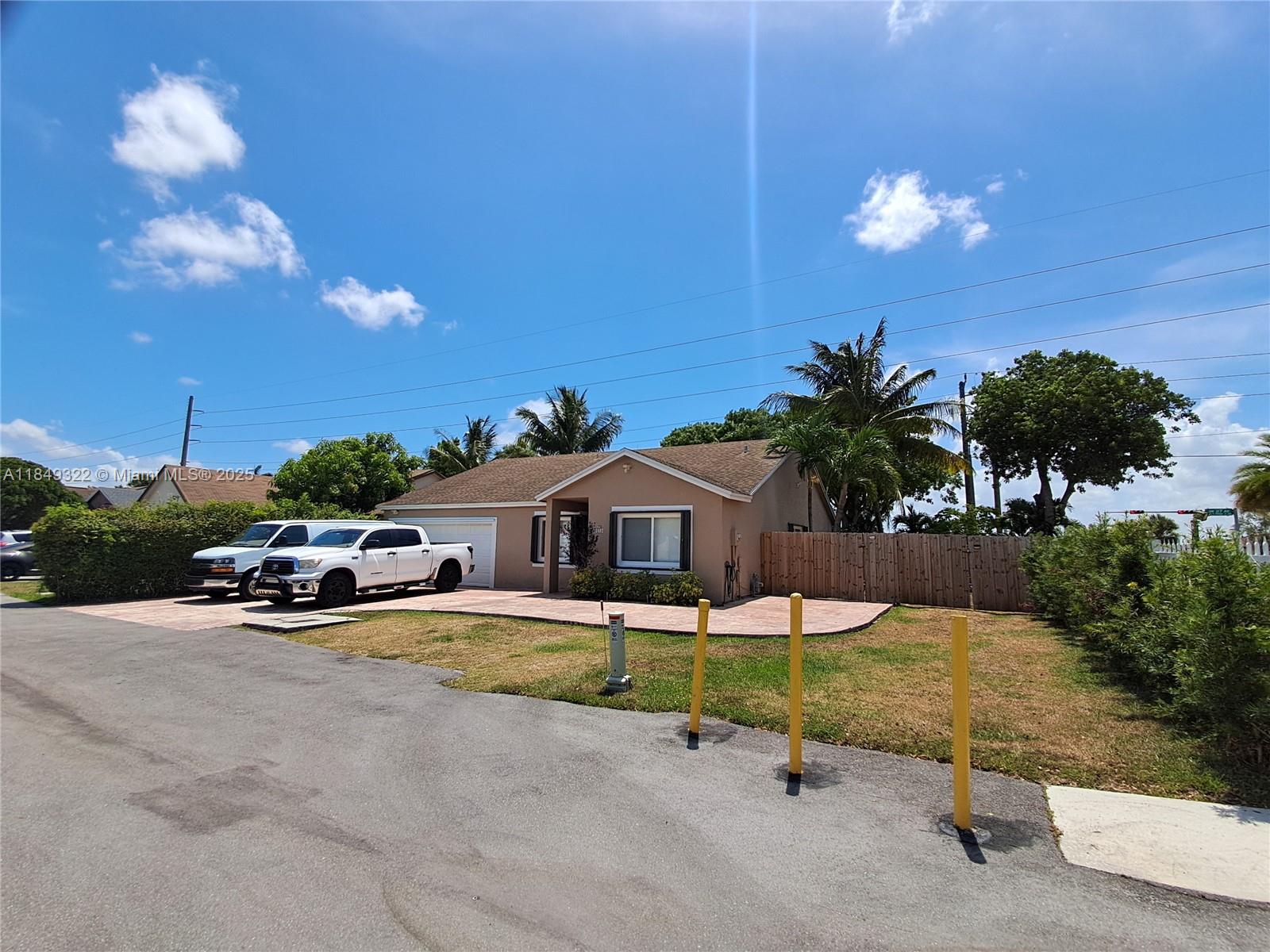 13402 Southwest 116th Place Miami, FL 33176 - Photo 2 of 16 a swimming pool with outdoor seating and yard