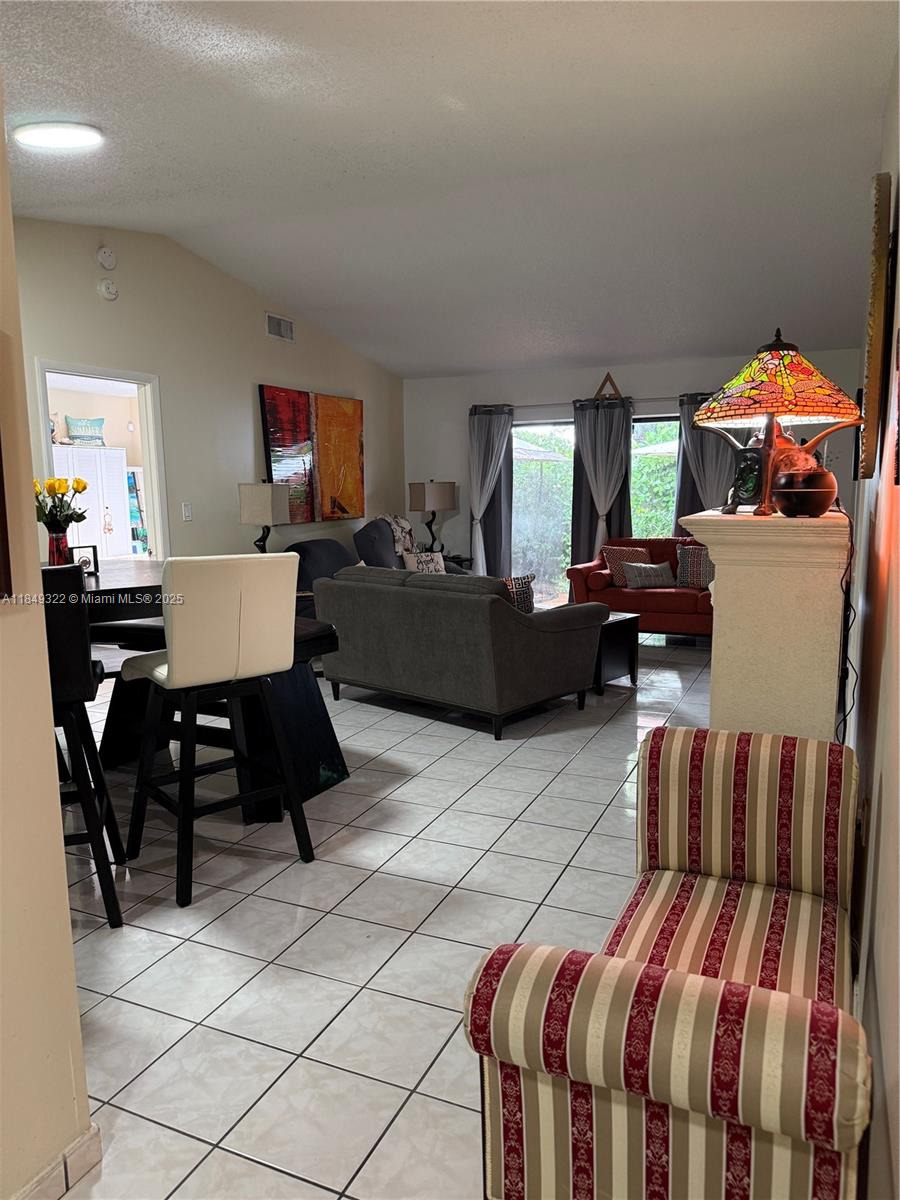 13402 Southwest 116th Place Miami, FL 33176 - Photo 4 of 16 a living room with furniture and a window