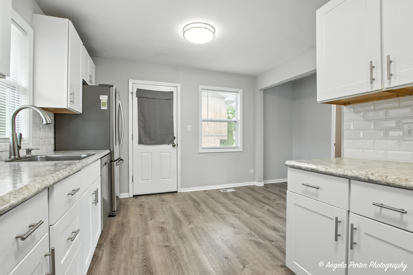 4420 Clearview Drive McHenry, IL 60050 - Photo 10 of 15 a kitchen with granite countertop white cabinets and sink