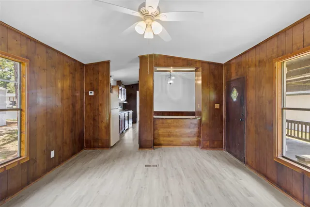 a view of empty room with closet and wooden floor