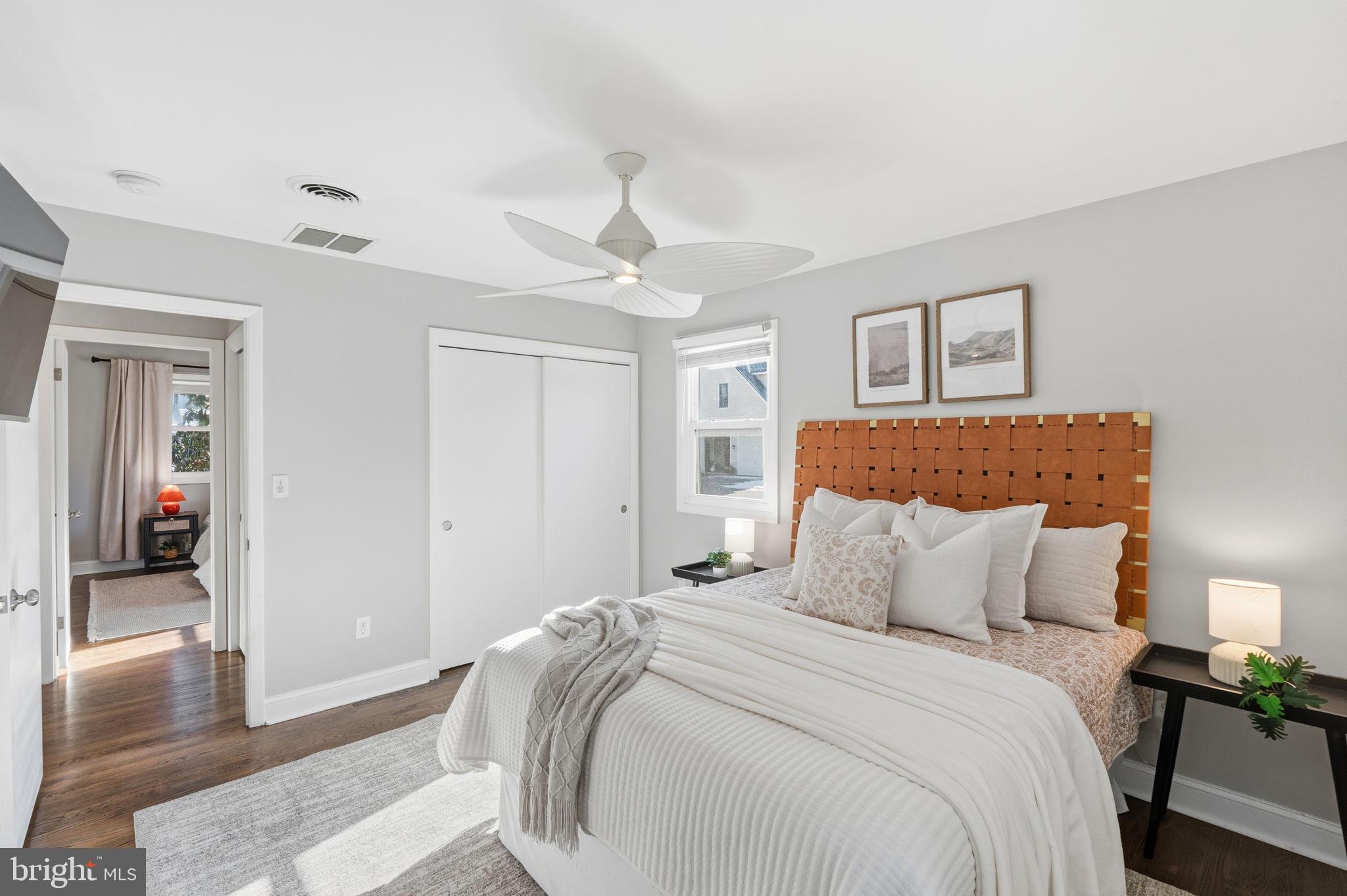 4231 Bartholows Road Mount Airy, MD 21771 - Photo 20 of 53 a bedroom with a large bed and a chandelier