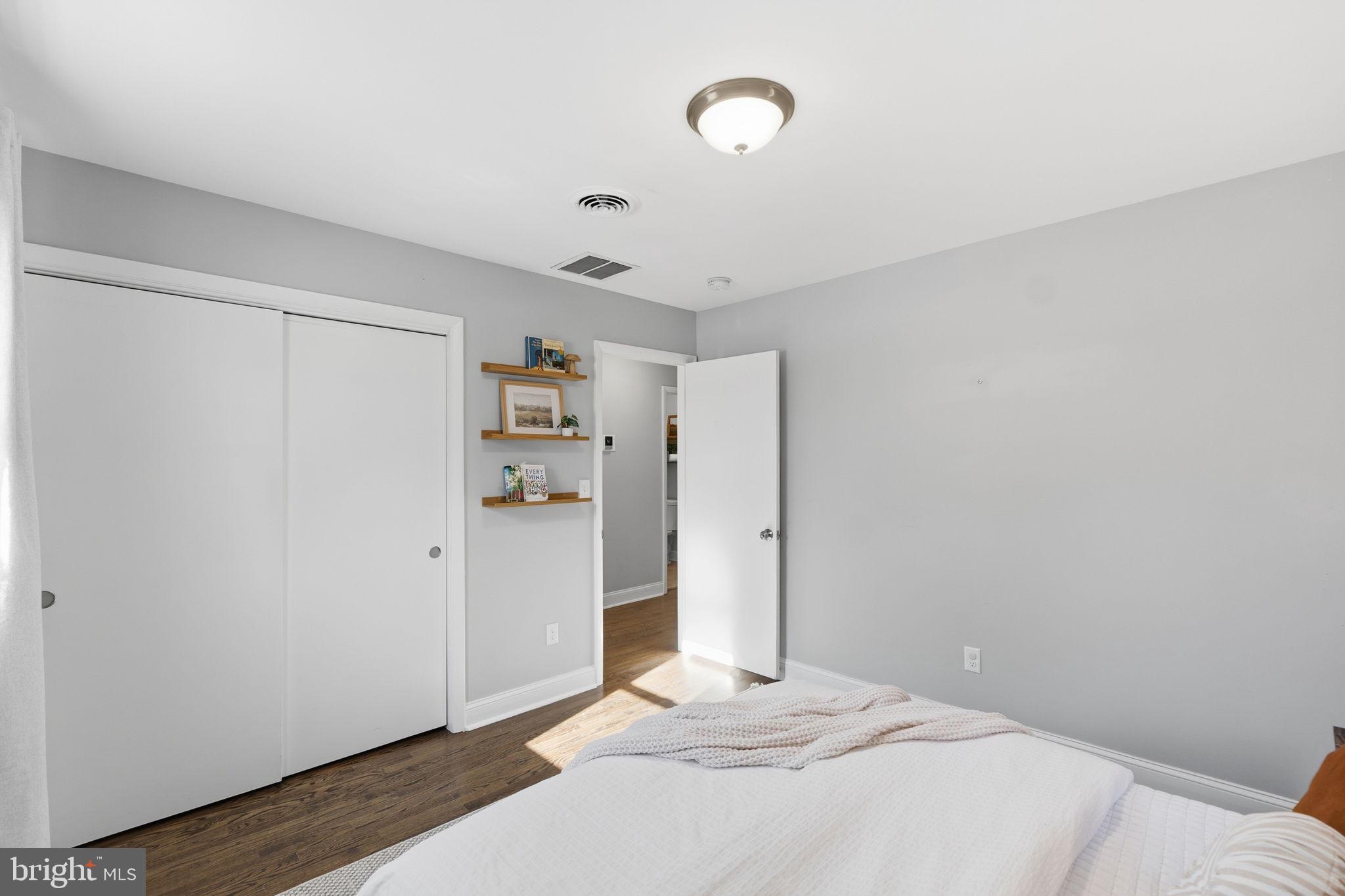 4231 Bartholows Road Mount Airy, MD 21771 - Photo 29 of 53 a bedroom with a bed and a refrigerator