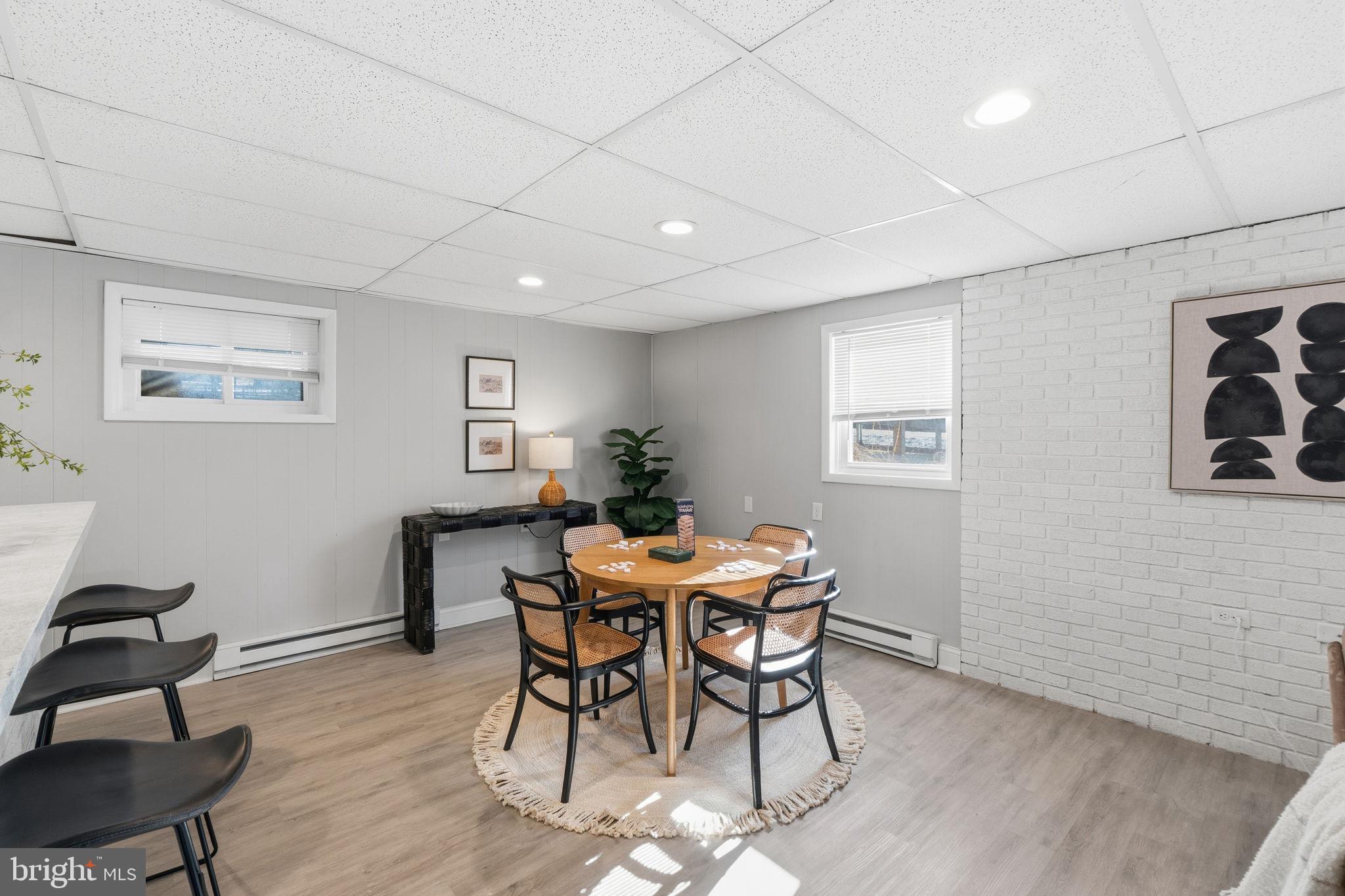 4231 Bartholows Road Mount Airy, MD 21771 - Photo 41 of 53 a view of a dining room with furniture and wooden floor