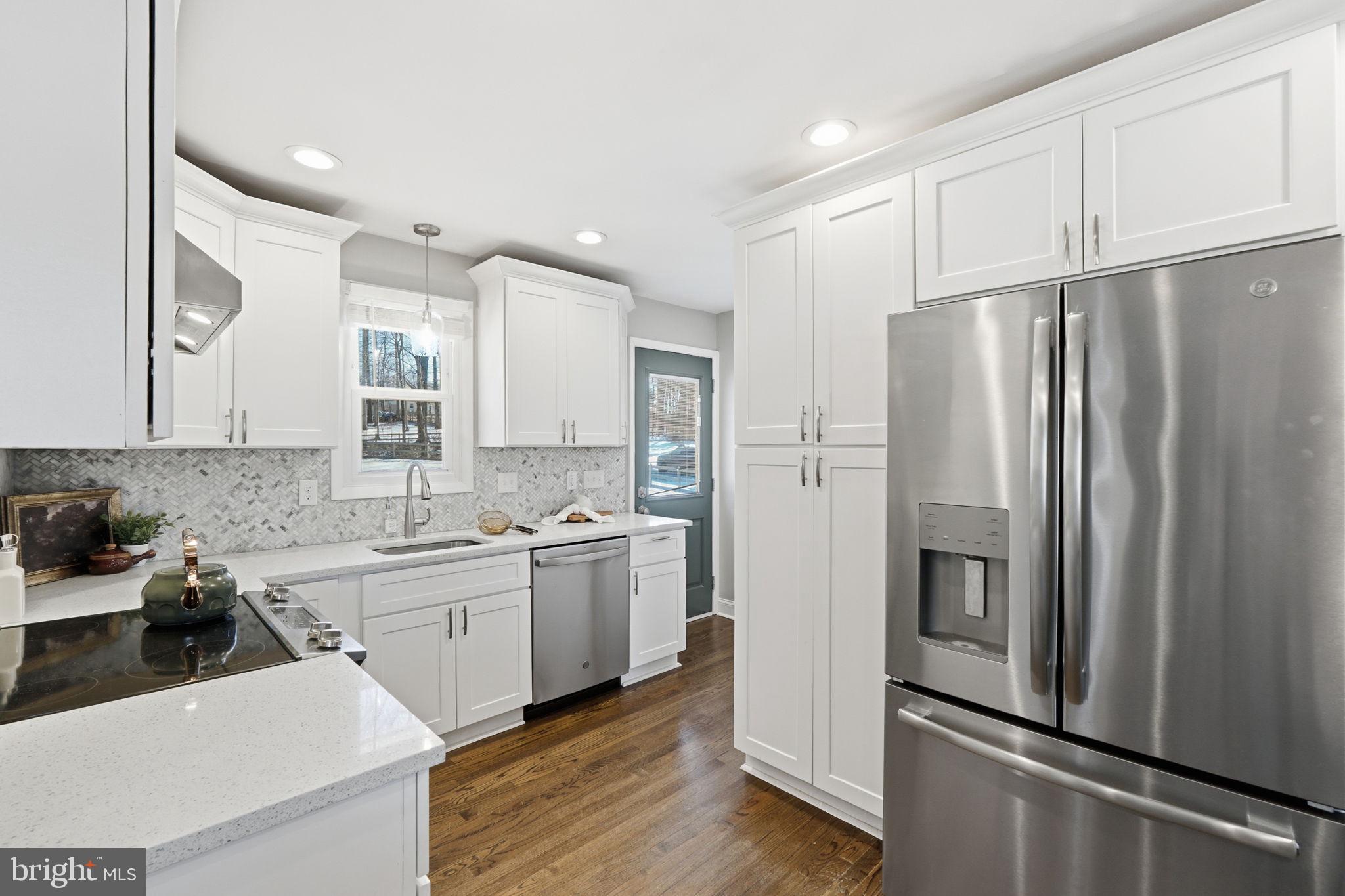 4231 Bartholows Road Mount Airy, MD 21771 - Photo 10 of 53 a kitchen with stainless steel appliances a refrigerator stove and sink