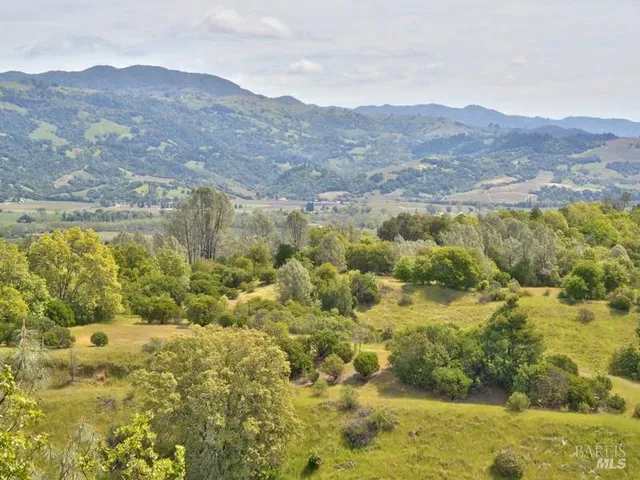 a view of mountain with green space