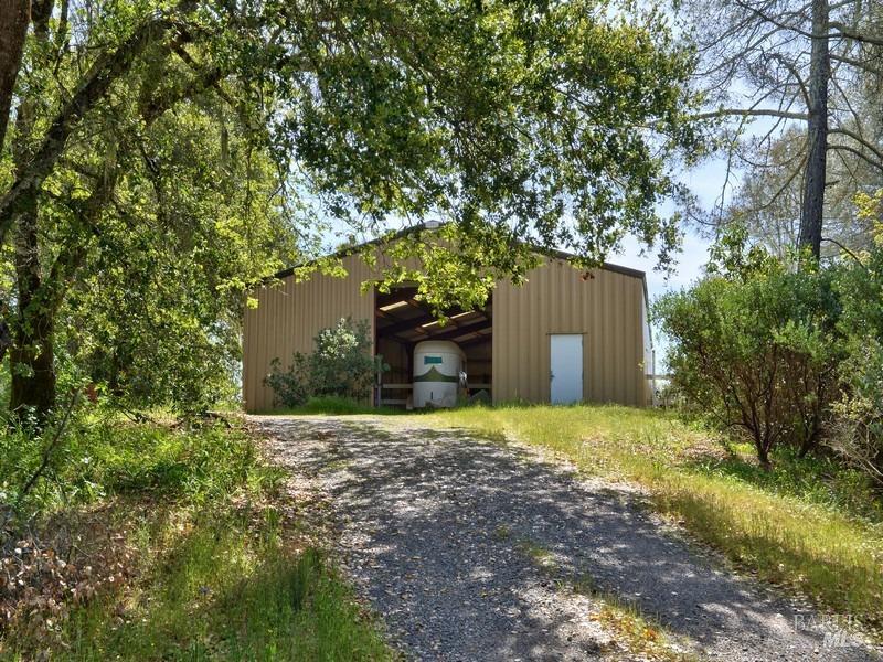 950 Canyon Road Geyserville, CA 95441 - Photo 10 of 23 a front view of a house with a yard and garage
