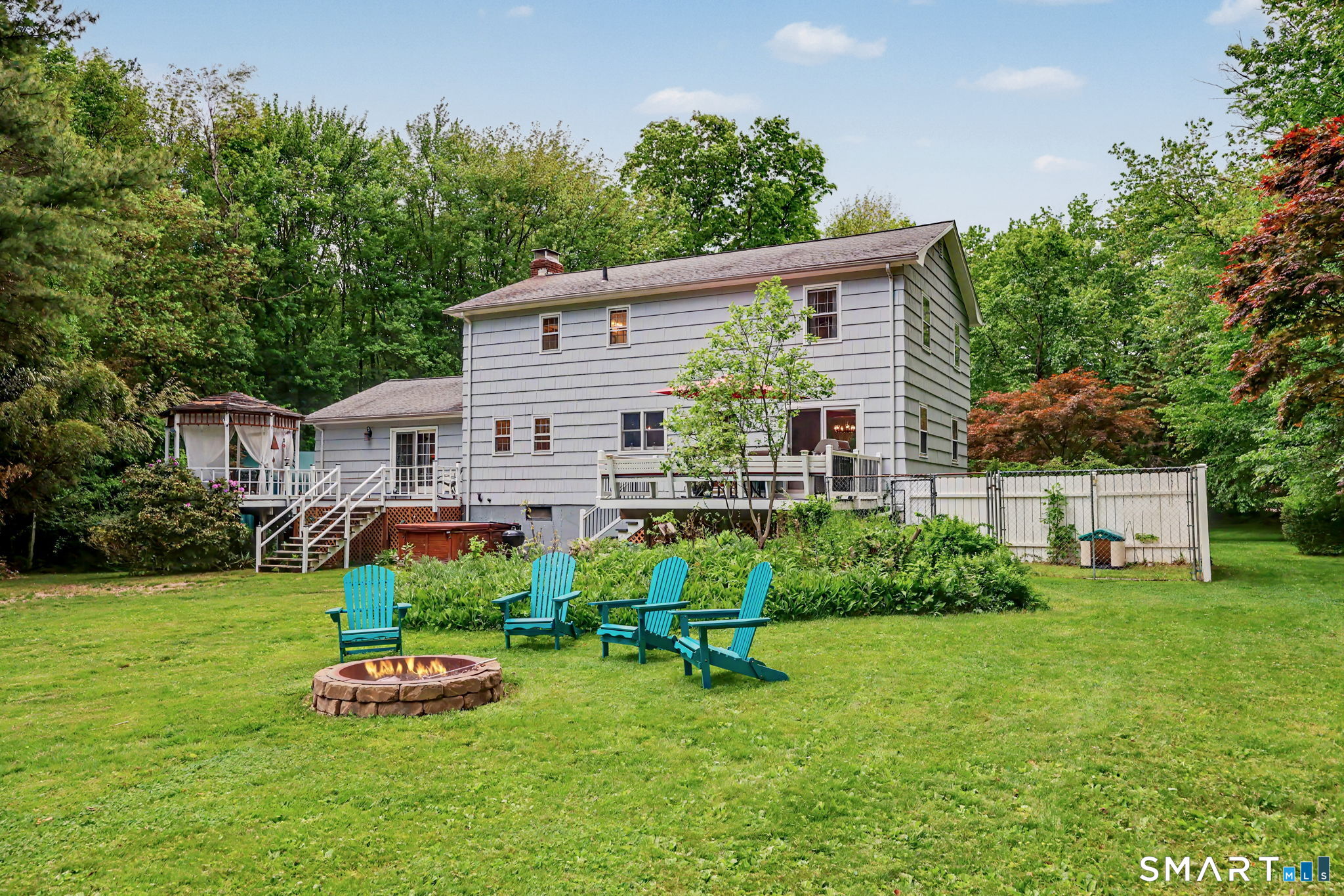 571 Wheeler Road Monroe, CT 06468 - Photo 28 of 40 a aerial view of a house with a yard table and chairs