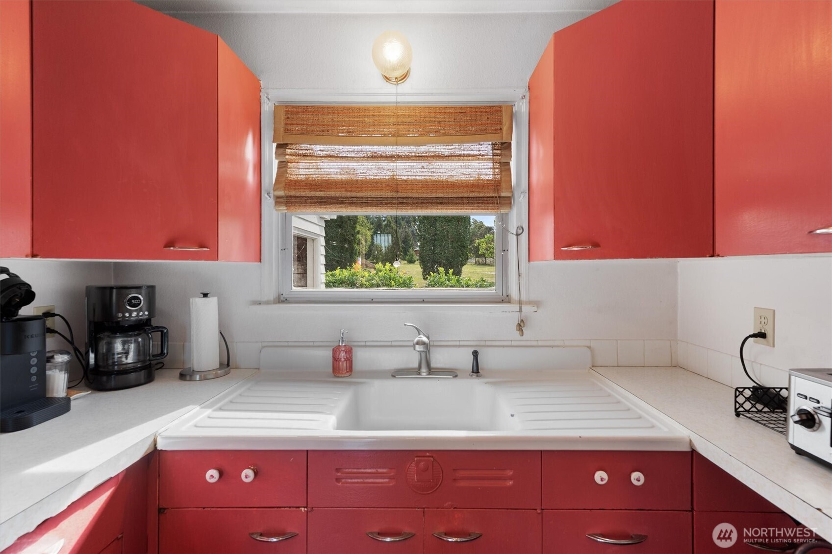 475 South 2nd Street Cathlamet, WA 98612 - Photo 14 of 40 a kitchen with a sink cabinets and window