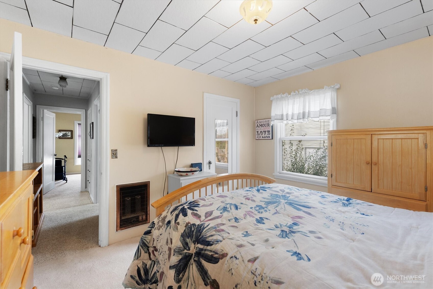 475 South 2nd Street Cathlamet, WA 98612 - Photo 22 of 40 a bedroom with furniture and a flat screen tv