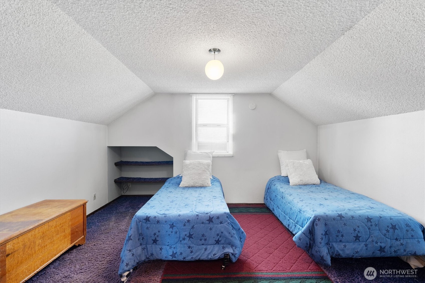475 South 2nd Street Cathlamet, WA 98612 - Photo 26 of 40 a spacious bedroom with a bed and wooden floor