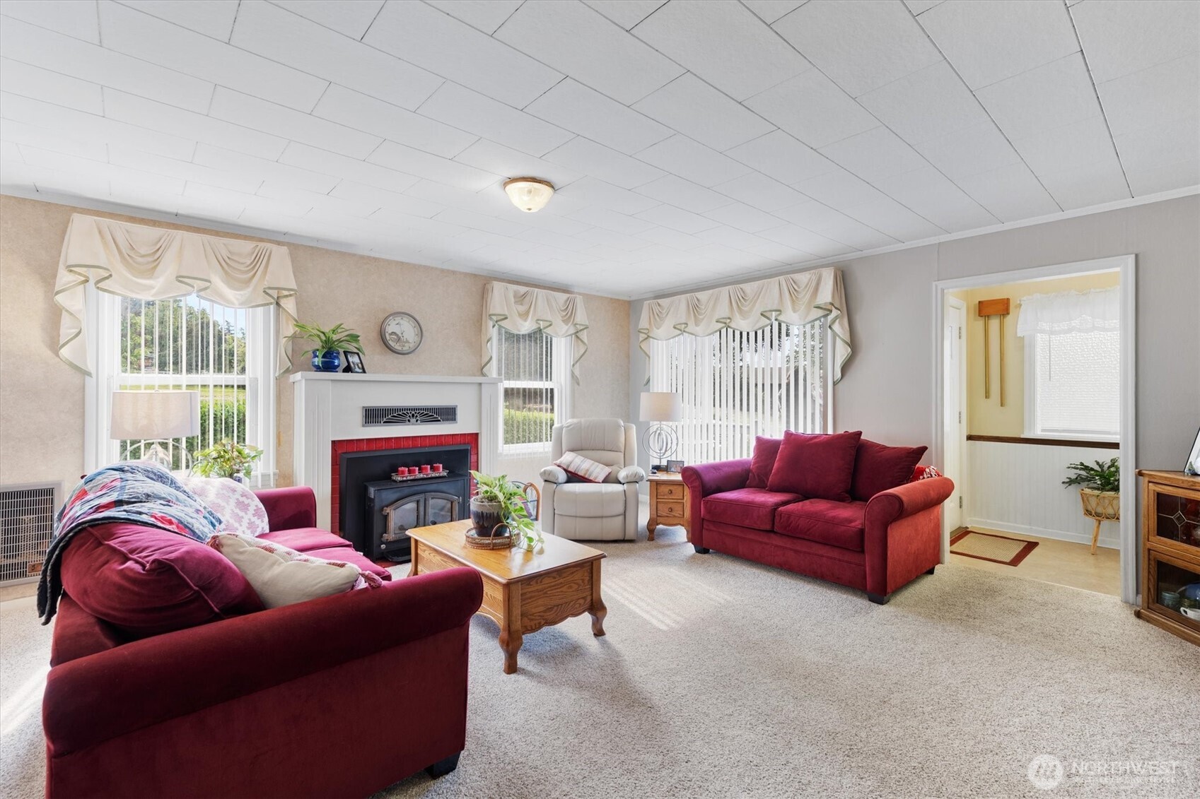 475 South 2nd Street Cathlamet, WA 98612 - Photo 9 of 40 a living room with furniture a fireplace and a large window