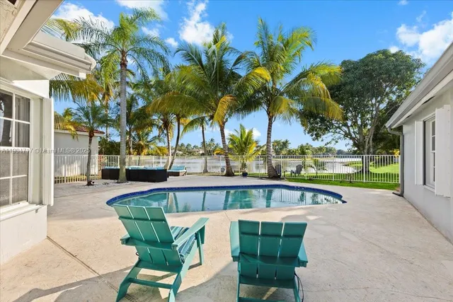 a view of a swimming pool with a patio