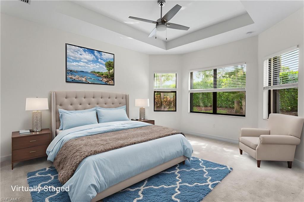 4486 Crimson Avenue Naples, FL 34119 - Photo 15 of 22 a spacious bedroom with a bed and glass window