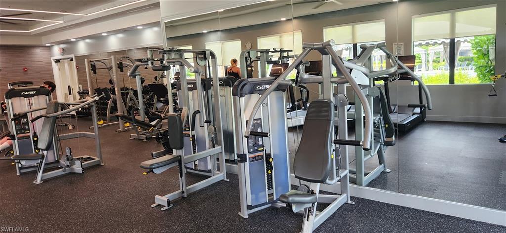 4486 Crimson Avenue Naples, FL 34119 - Photo 17 of 22 a view of a room with gym equipment