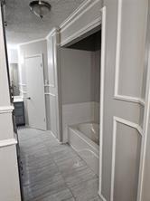 6530 Talbot Parkway Dallas, TX 75232 - Photo 14 of 18 a bathroom with a bathtub and a shower