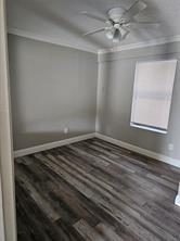 6530 Talbot Parkway Dallas, TX 75232 - Photo 16 of 18 a view of empty room with wooden floor and fan