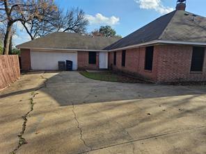 6530 Talbot Parkway Dallas, TX 75232 - Photo 3 of 18 a front view of a house with a yard and garage