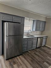 6530 Talbot Parkway Dallas, TX 75232 - Photo 8 of 18 a refrigerator freezer sitting inside of a kitchen