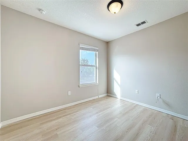 a bathroom with a double vanity sink toilet mirror and shower