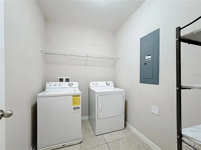 a bedroom with furniture and a potted plant