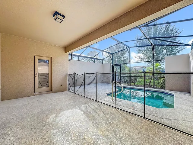 an aerial view of residential houses with outdoor space and river