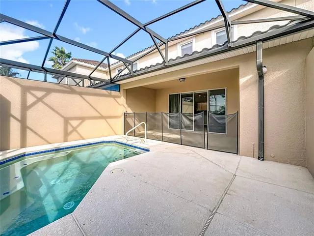 an aerial view of residential houses with outdoor space and river
