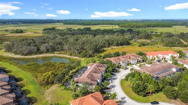 a view of a patio with table and chairs under an umbrella