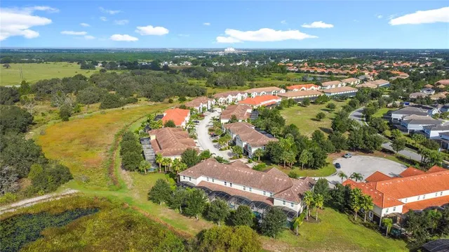 an aerial view of a house with yard swimming pool and outdoor seating