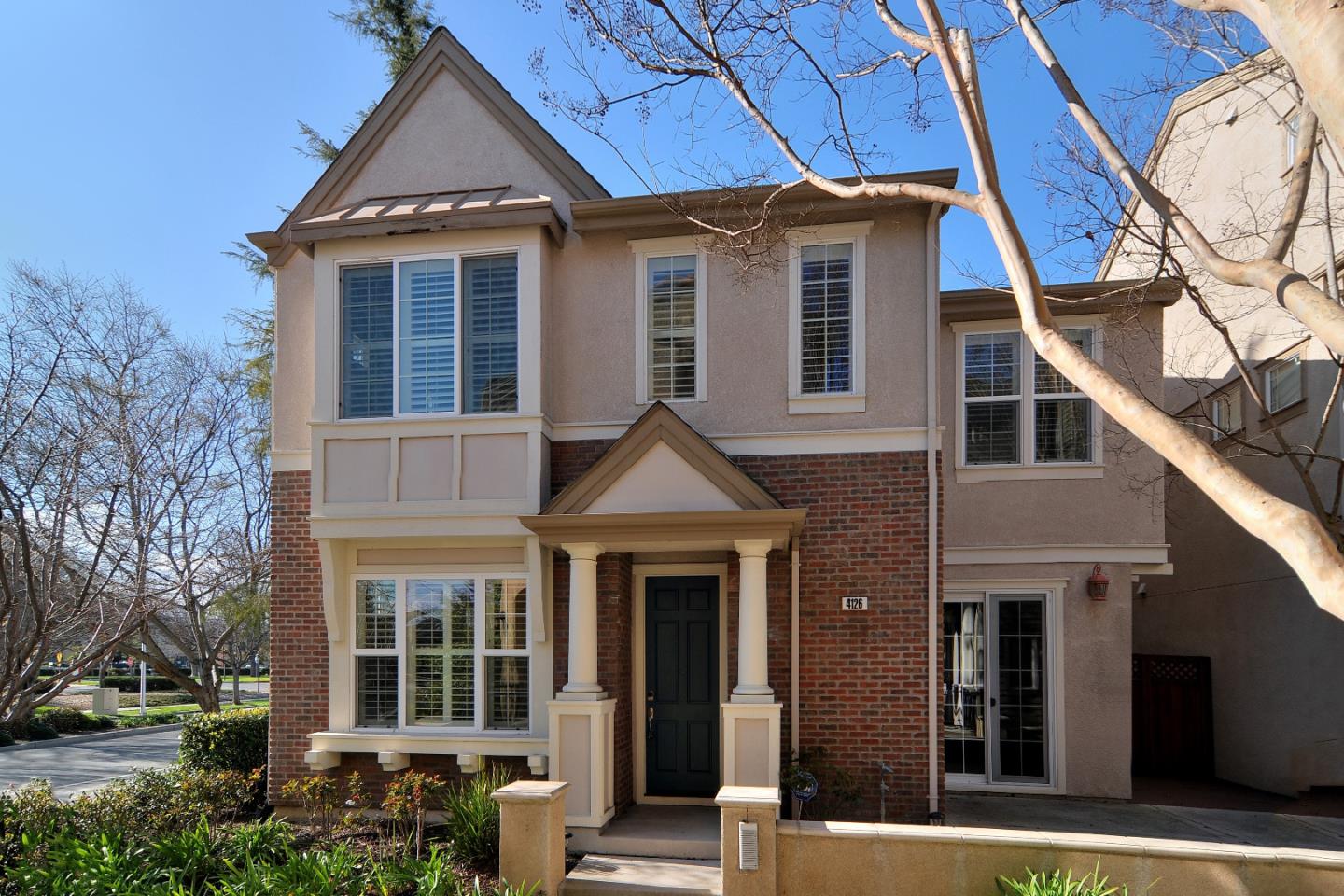 a front view of a house with garden