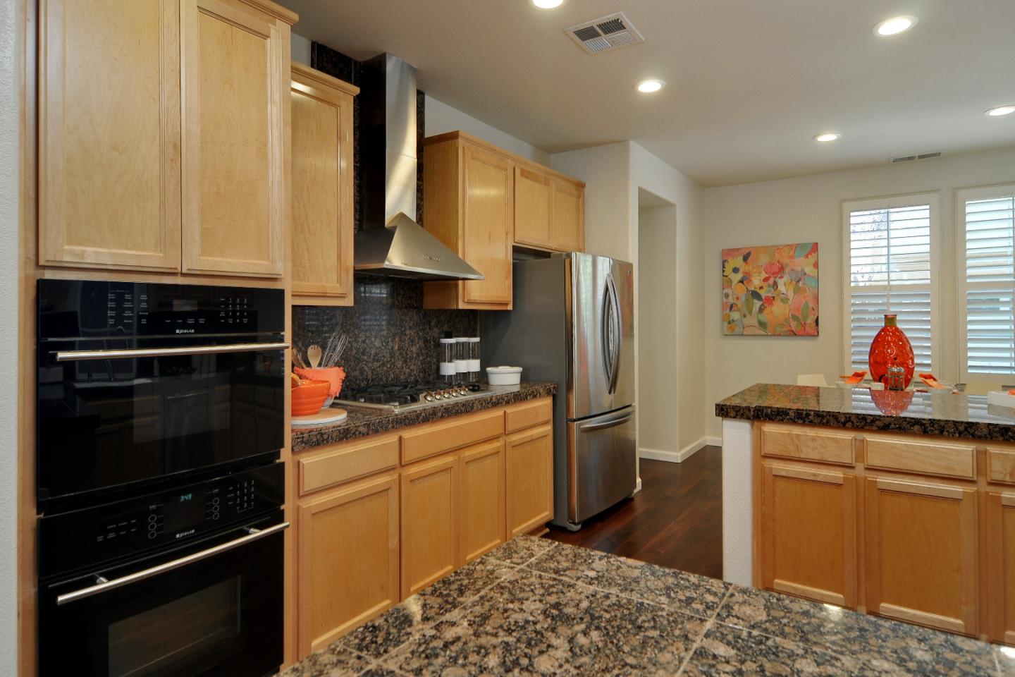 4126 Tobin Circle Santa Clara, CA 95054 - Photo 6 of 16 a kitchen with stainless steel appliances granite countertop a refrigerator sink and stove