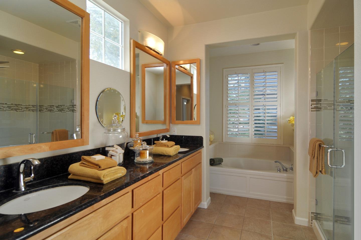 4126 Tobin Circle Santa Clara, CA 95054 - Photo 8 of 16 a bathroom with double vanity sinks a mirror and a bathtub