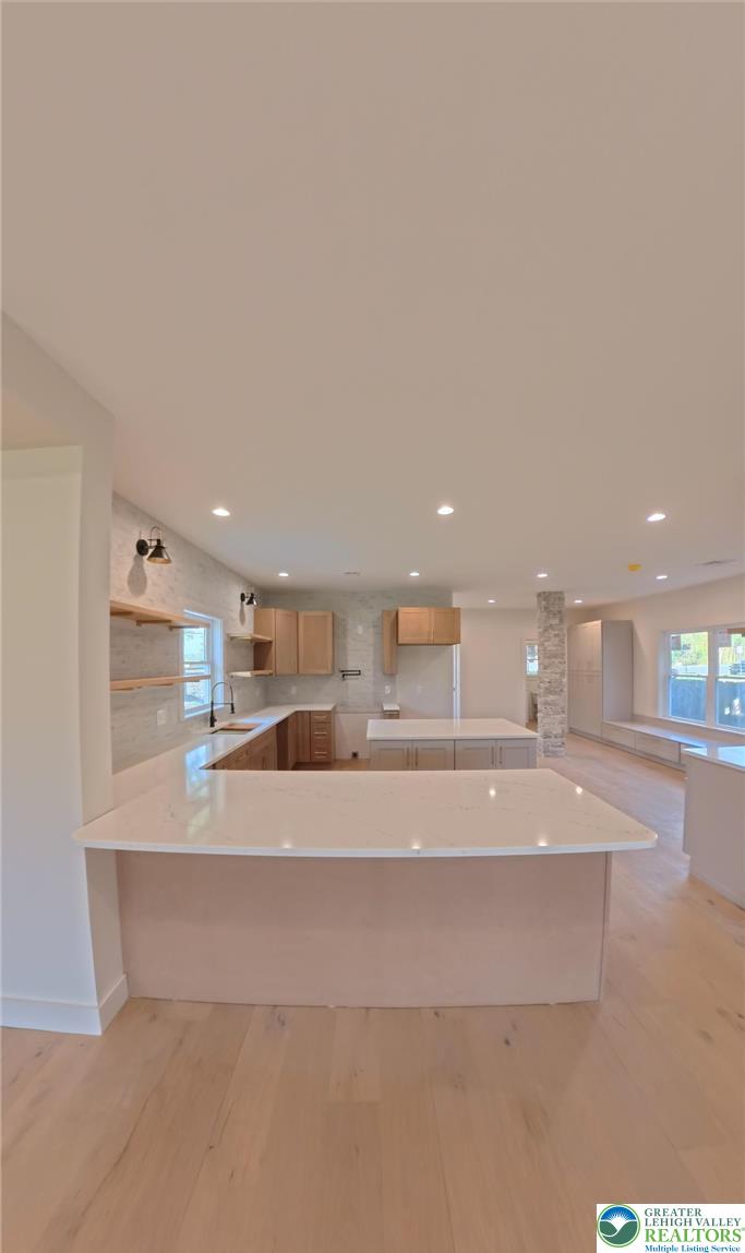 41 South 2nd Street Emmaus, PA 18049 - Photo 7 of 37 a large kitchen with kitchen island a sink stainless steel appliances and cabinets