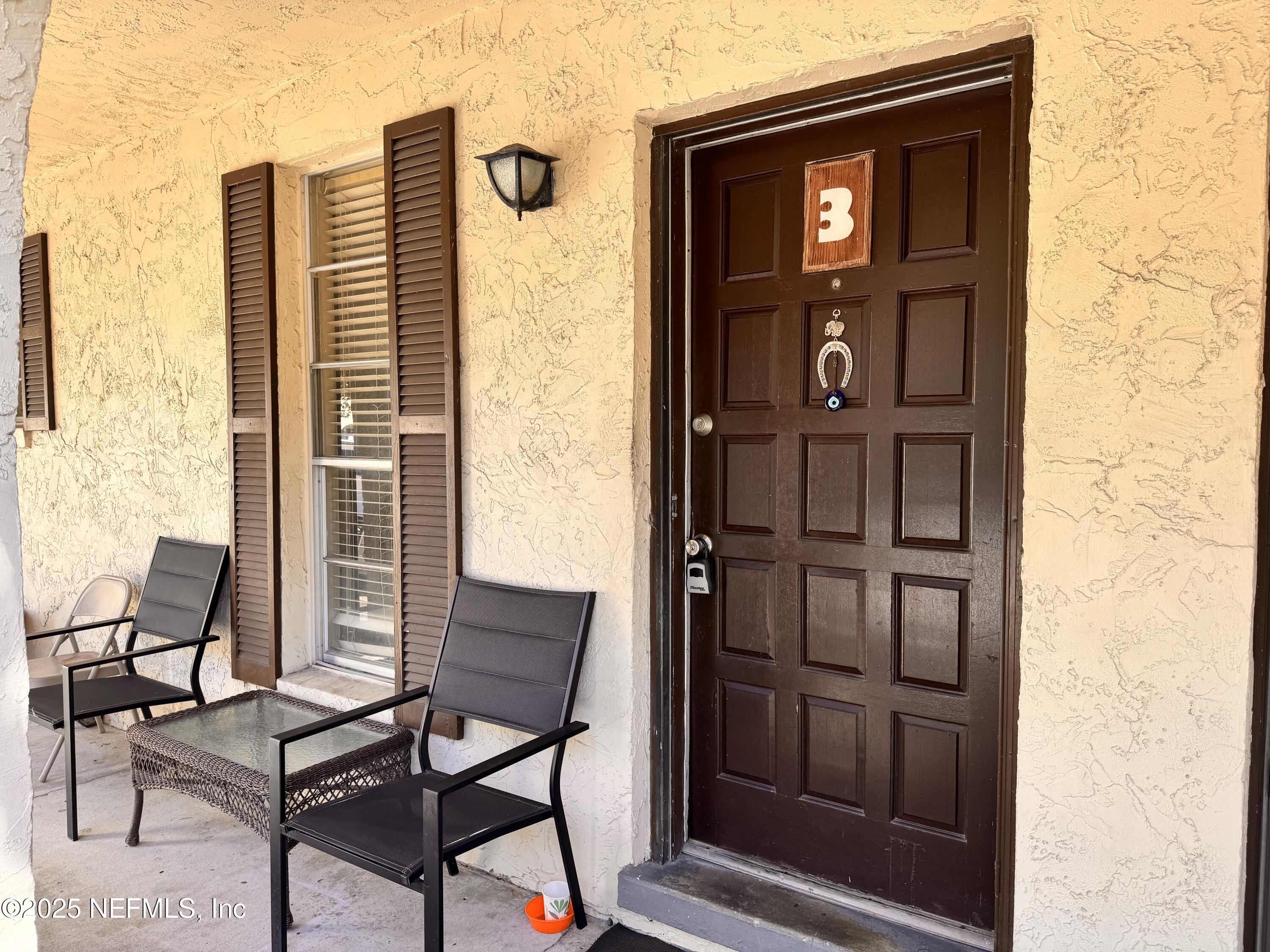 1707 El Prado Road, Unit 3 Jacksonville, FL 32216 - Photo 1 of 24 a view of a door and chair in the balcony