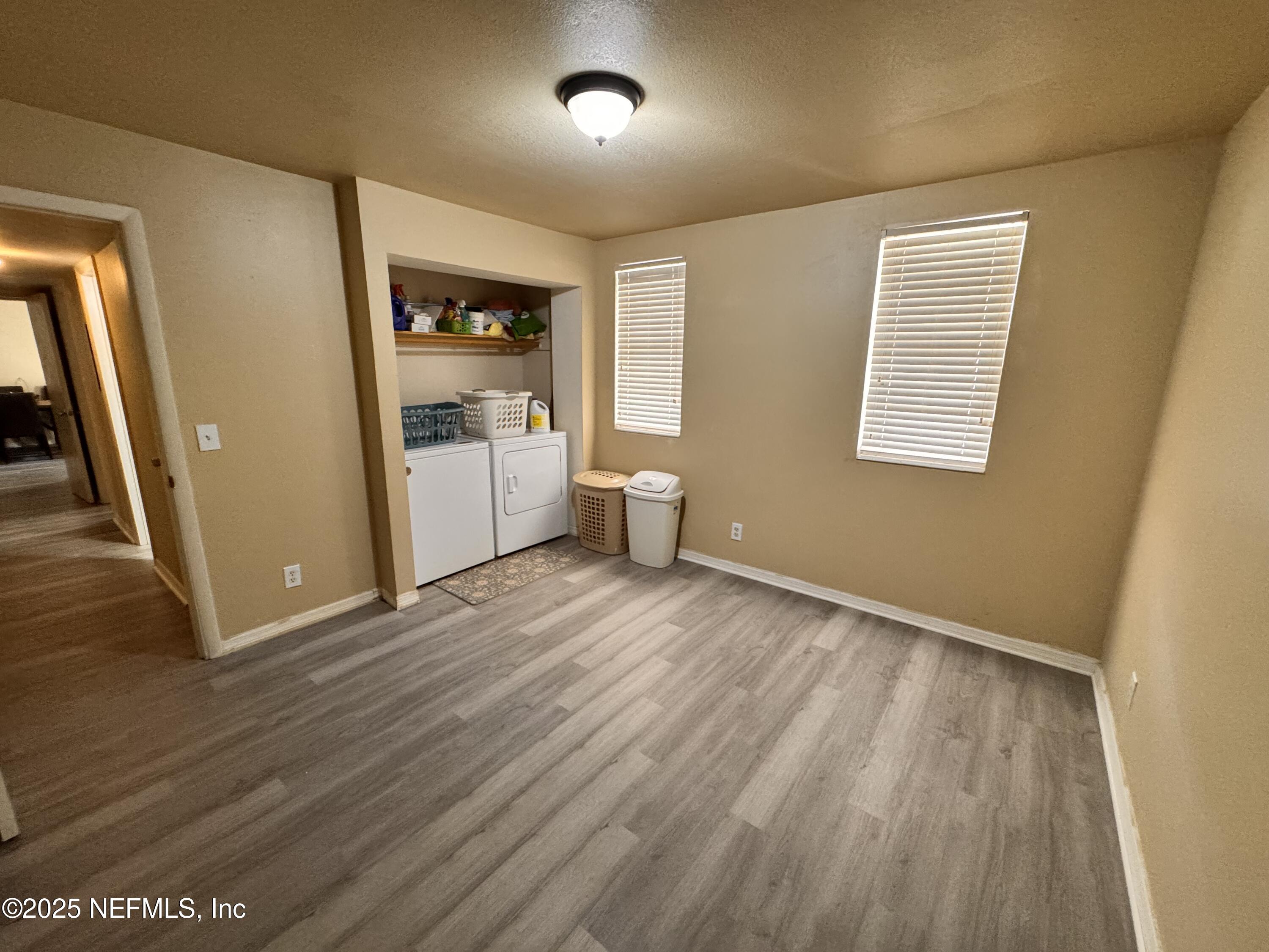 1707 El Prado Road, Unit 3 Jacksonville, FL 32216 - Photo 14 of 24 wooden floor in an empty room with a window