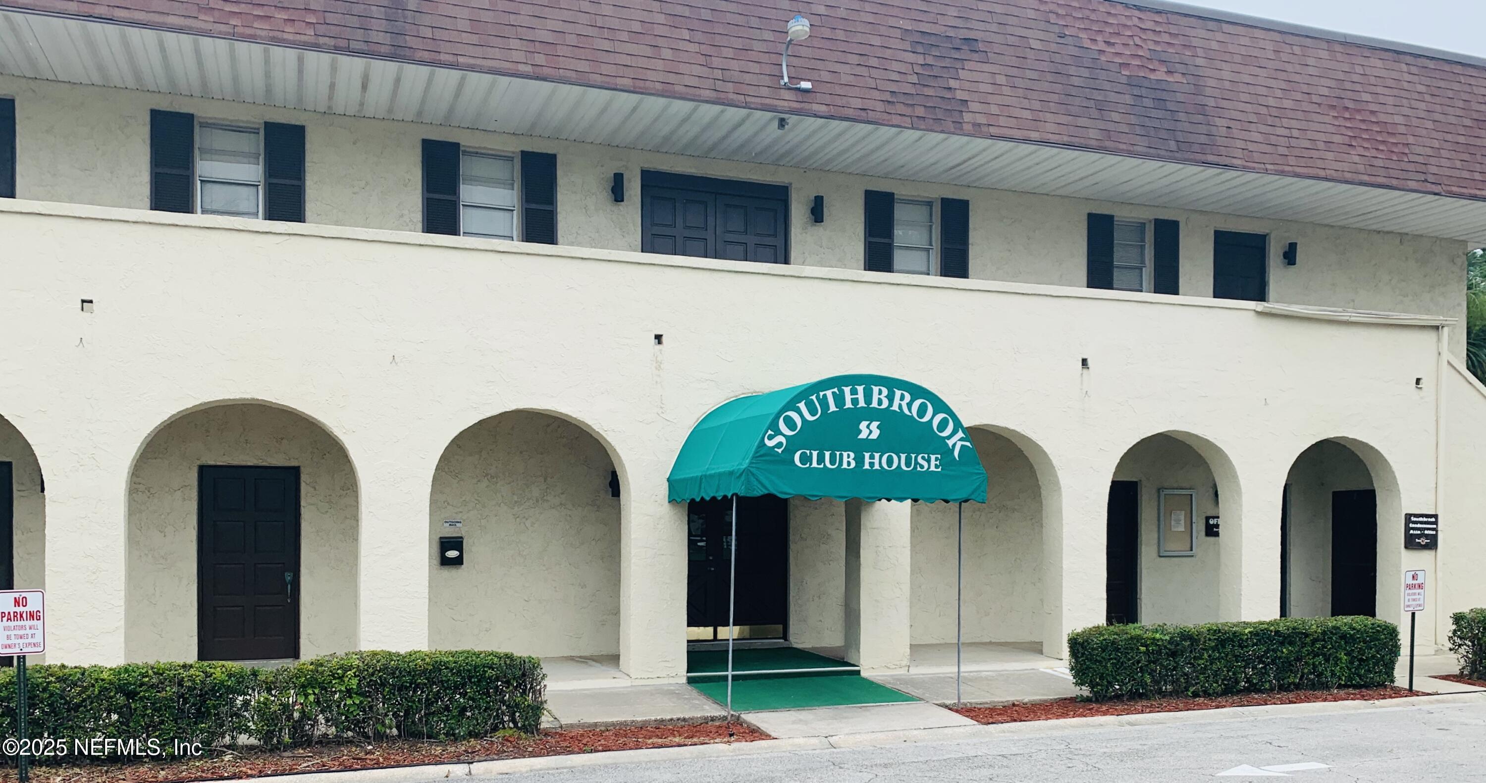 1707 El Prado Road, Unit 3 Jacksonville, FL 32216 - Photo 19 of 24 a view of a brick house with potted plants