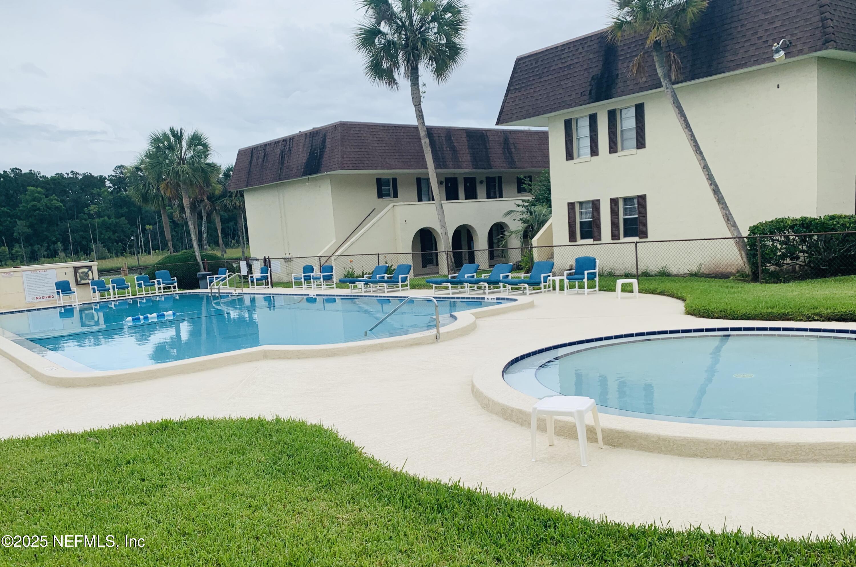 1707 El Prado Road, Unit 3 Jacksonville, FL 32216 - Photo 20 of 24 a view of a house with a swimming pool