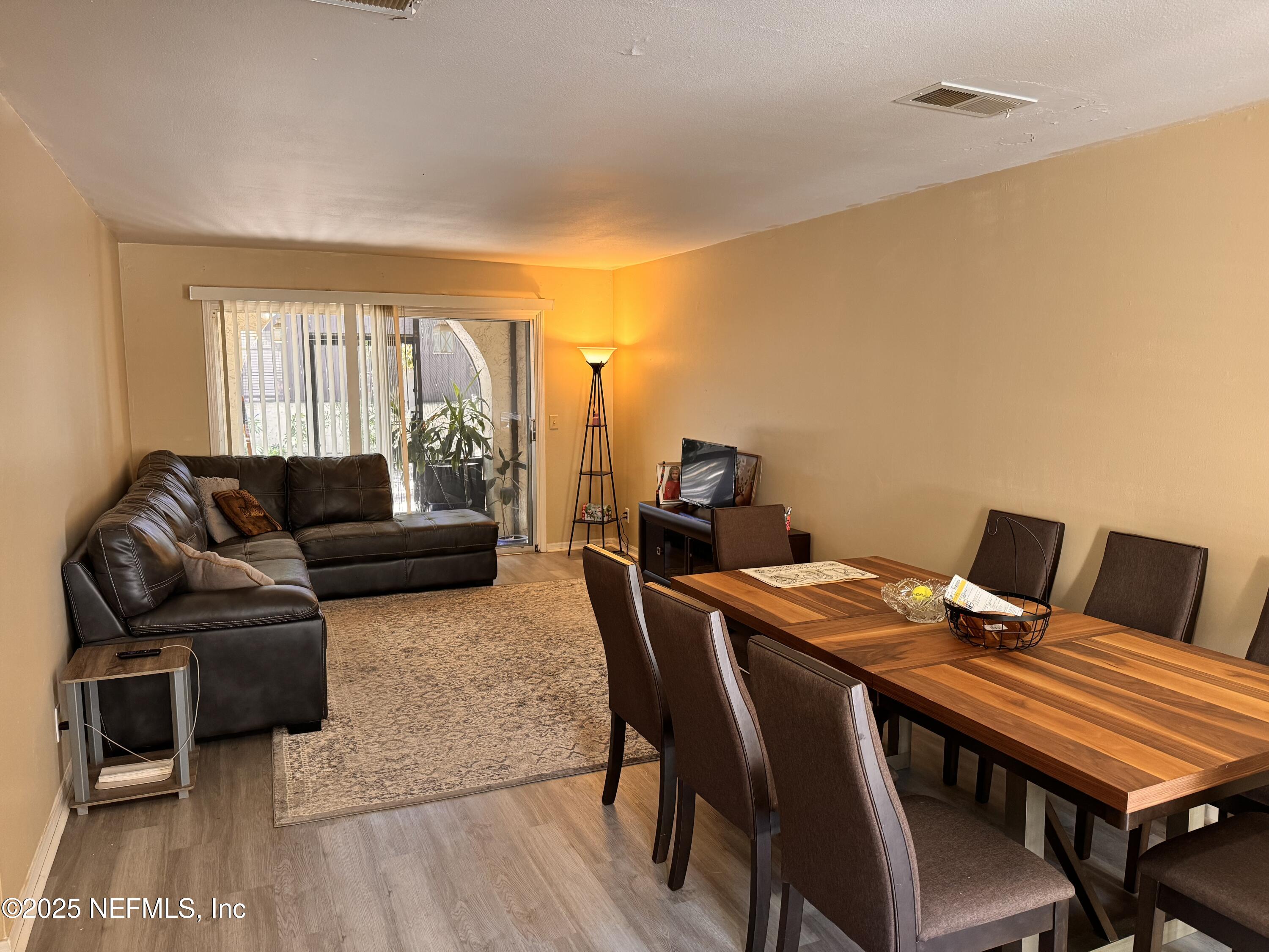 1707 El Prado Road, Unit 3 Jacksonville, FL 32216 - Photo 4 of 24 a living room with furniture and a window