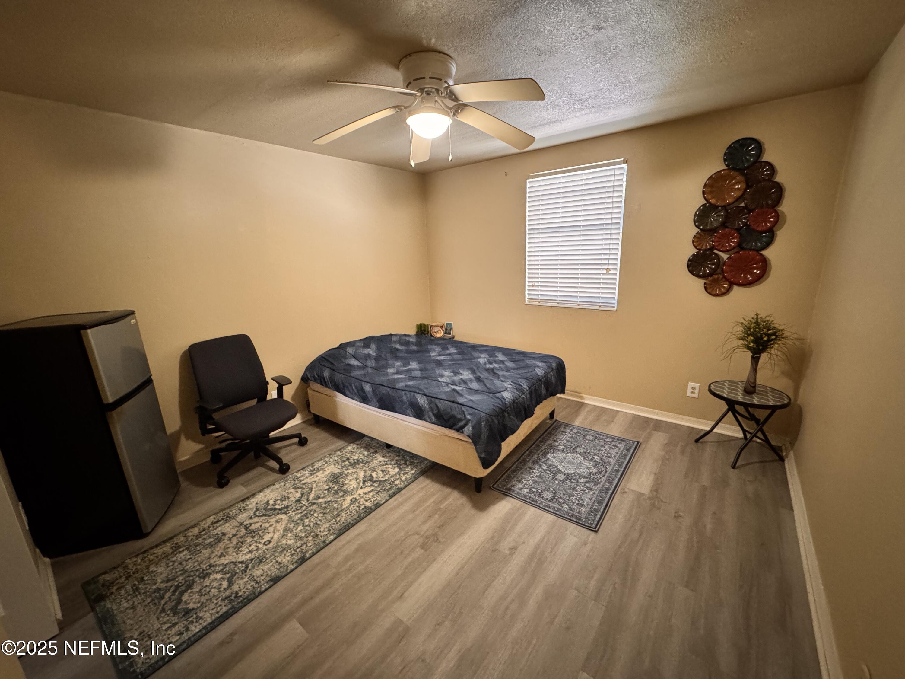 1707 El Prado Road, Unit 3 Jacksonville, FL 32216 - Photo 9 of 24 a bed room with a bed and a couch